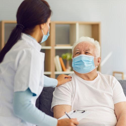 Doctor and Patient wearing face masks during consult