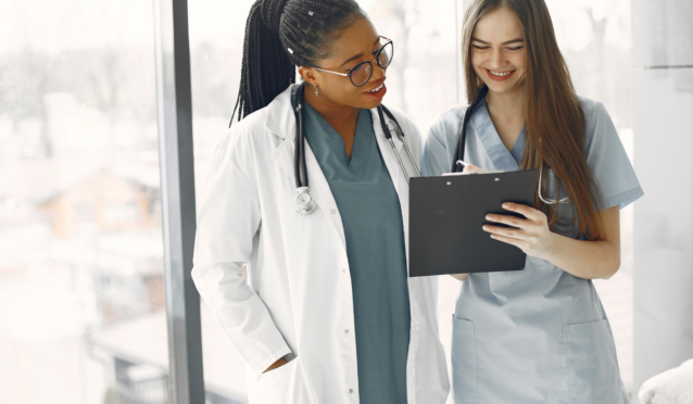 Doctor and nurse looking over chart review